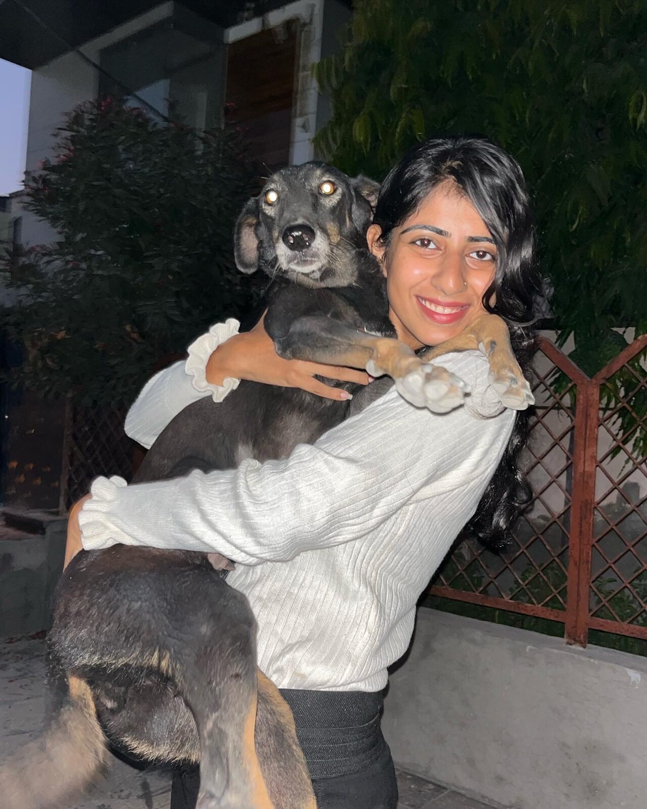 Suhani hugging a rescued dog