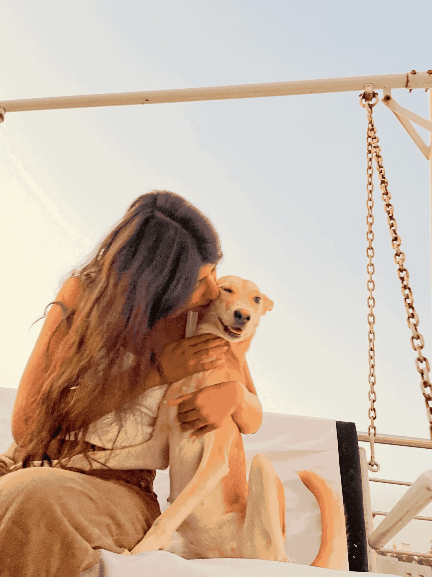 Suhani, Pawwtalks founder, embracing her rescued dog Twinkle